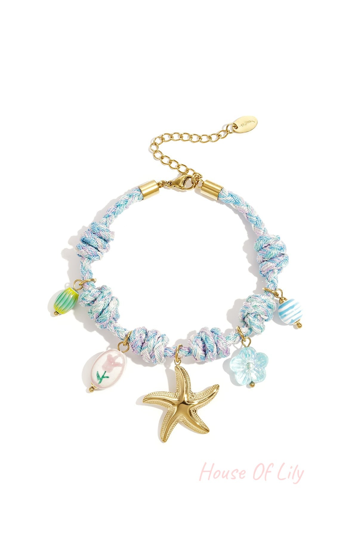 Blue and pastel twisted rope charm bracelet featuring a golden starfish pendant with floral and striped glass charms