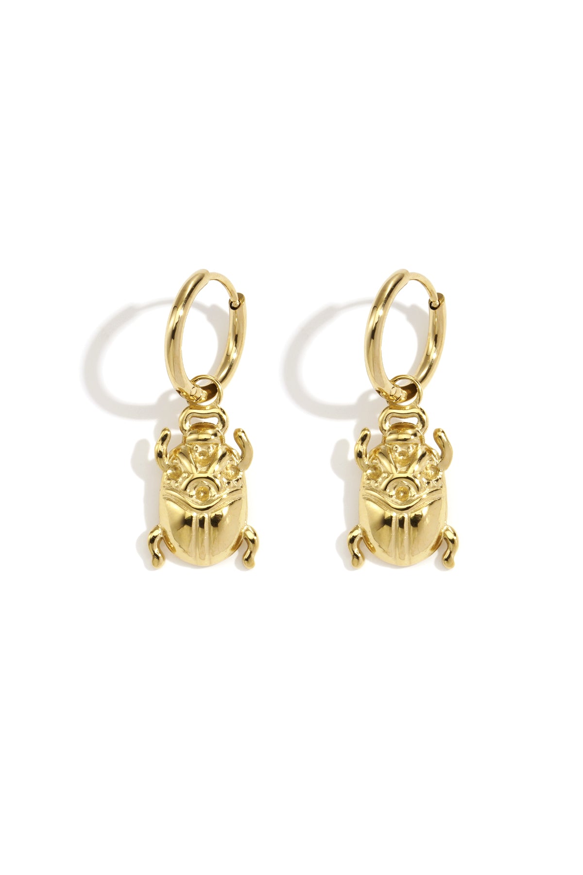Pair of polished gold bug-shaped drop earrings with hoop fastenings displayed on white background