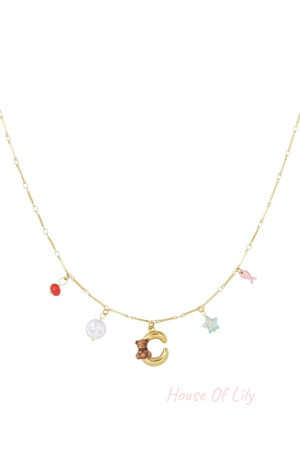 Gold charm necklace with gold pineapple, green flower, pink heart, red cherries, and blue chili pepper charms