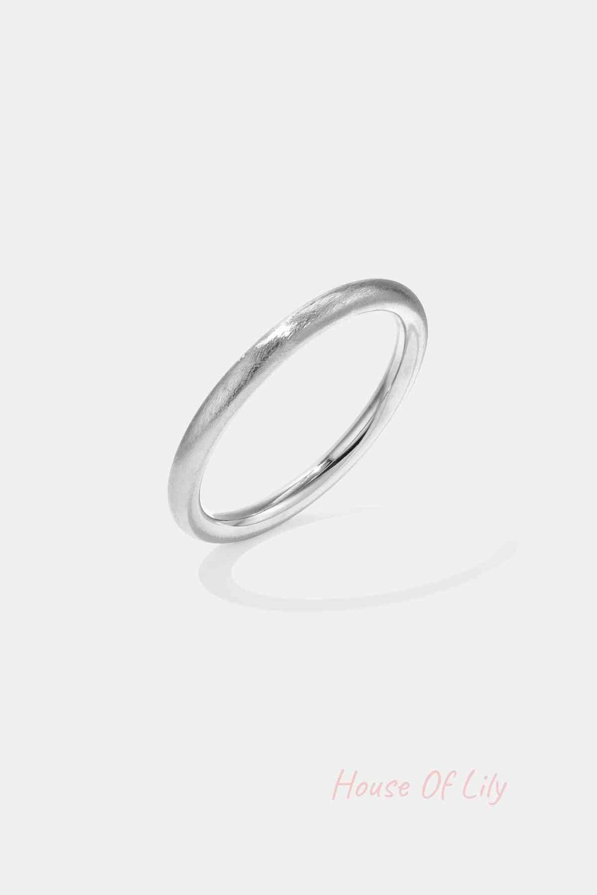 Single matte silver bangle with smooth circular design isolated on white background