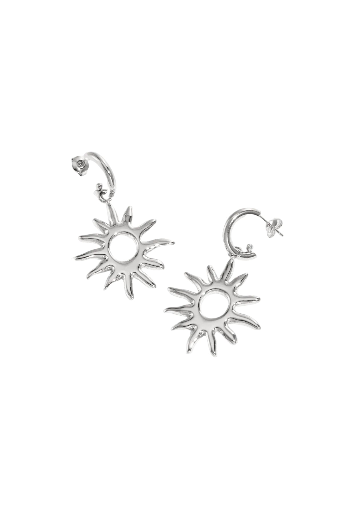 Silver sunburst drop earrings lying flat on white background, showing smooth, radiant design