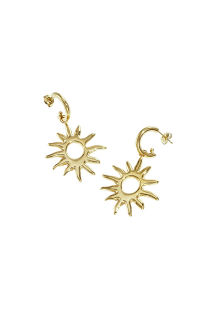 Pair of gold sunburst drop earrings with smooth sun motif and post backings on white background