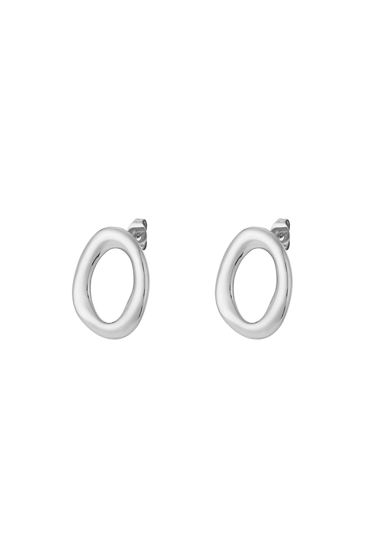 Pair of silver modern oval stud earrings with smooth irregular shape on white background