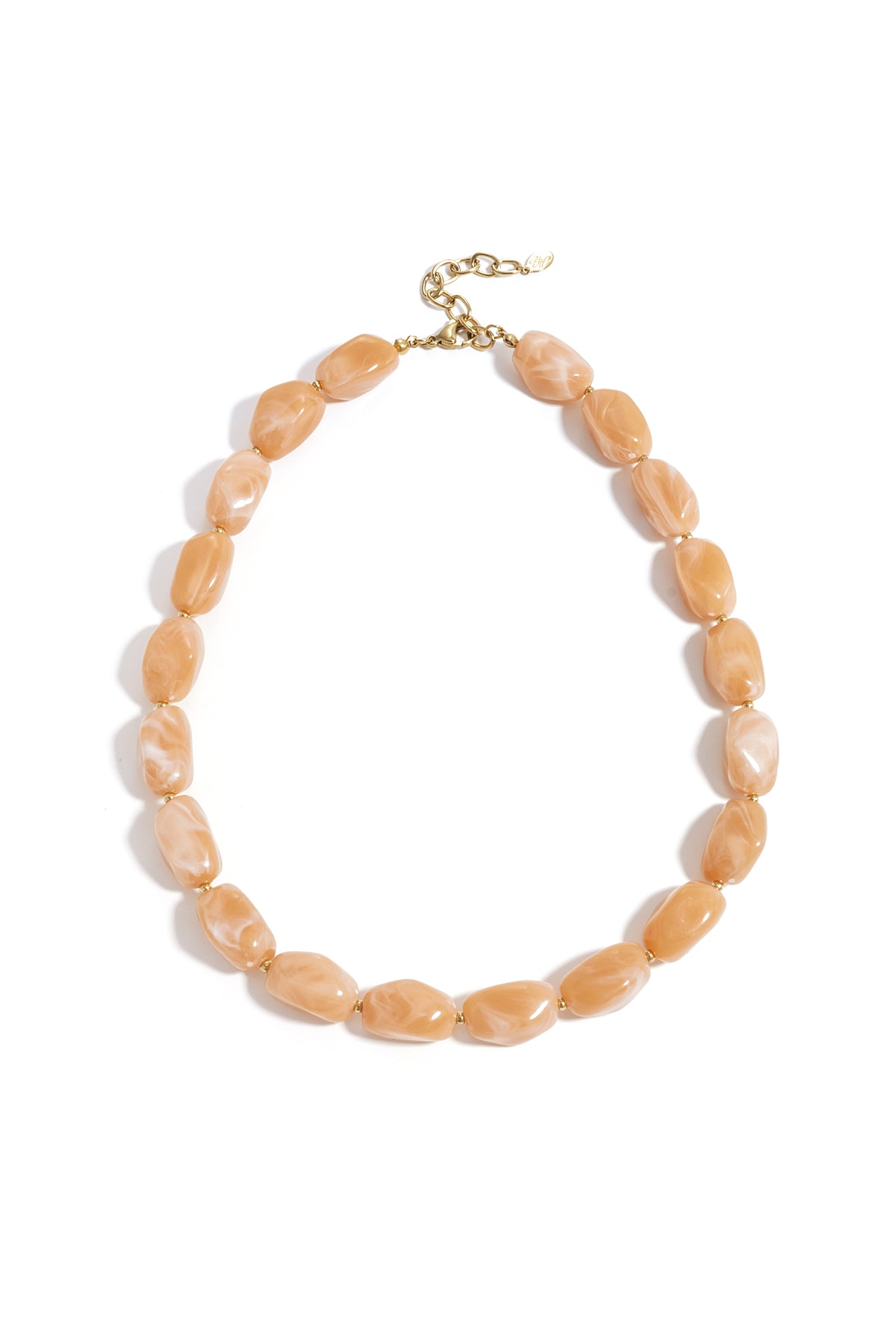 Light peach chunky beaded necklace with gold spacers and lobster clasp on white background