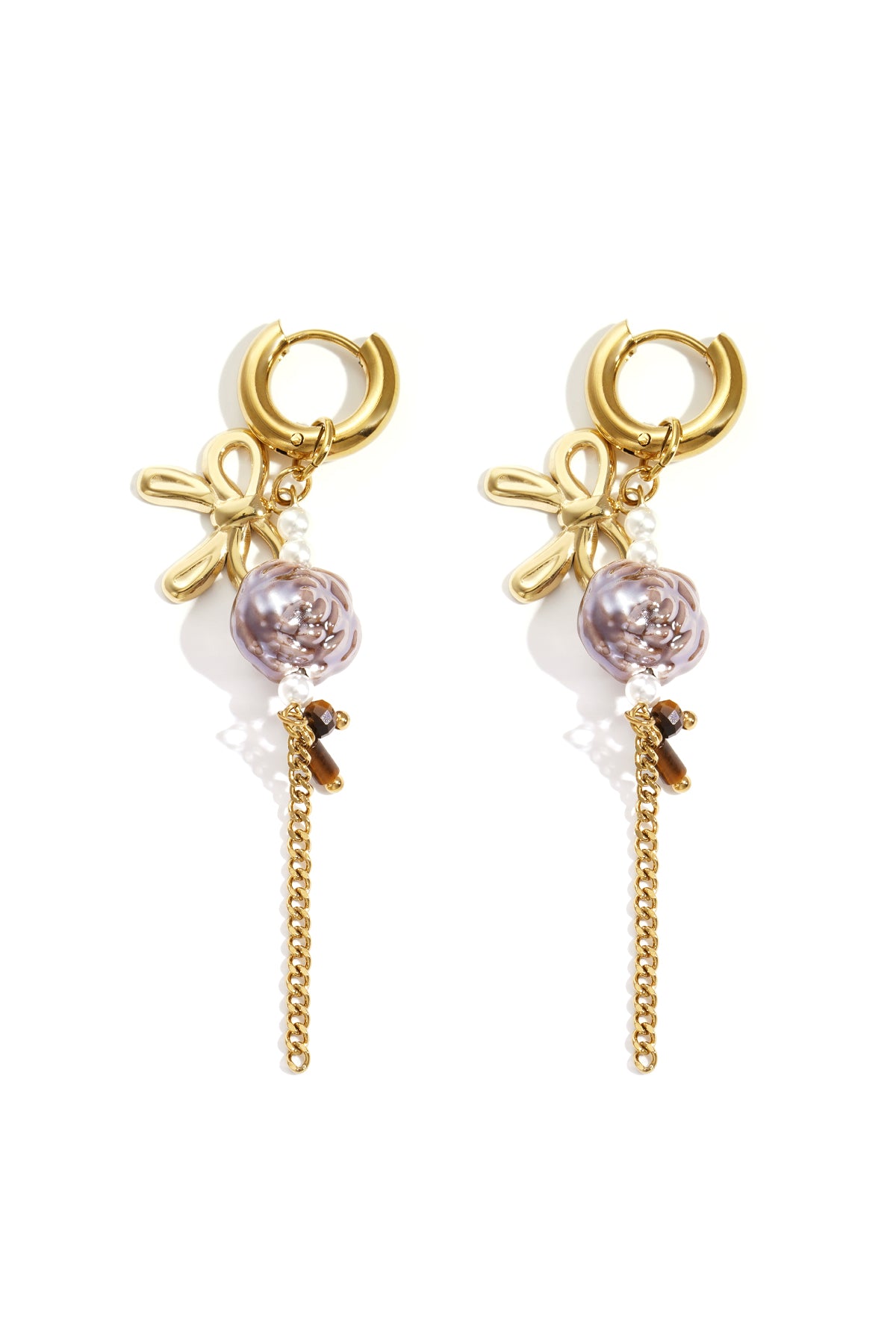 Pair of gold-tone floral drop earrings featuring bow motifs, purple flower beads, faux pearls, and dangling gold chains on white background