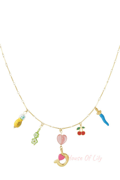 Gold charm necklace with green fish, red coral, gold letter E with pink flower, white star charm, and green flower charms