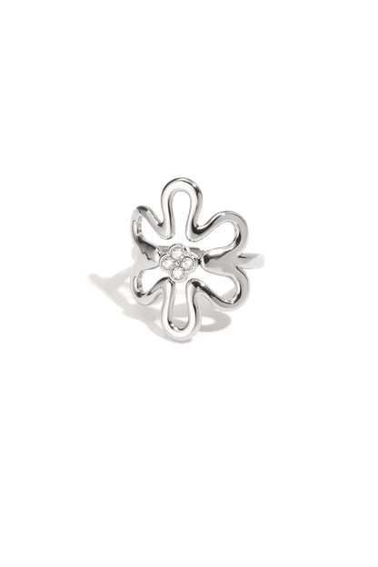 Silver tone playful flower statement ring with rhinestone cluster center on white background