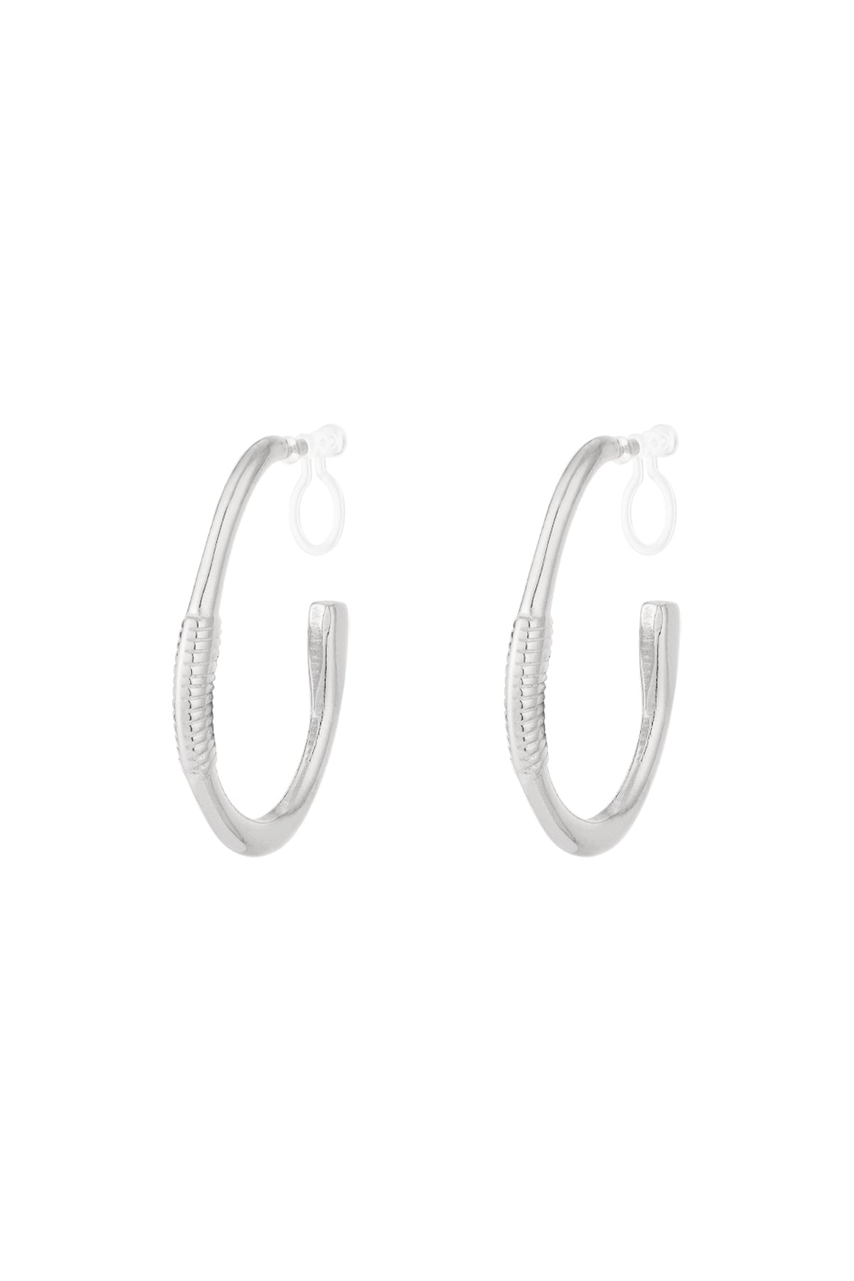 Pair of silver textured hoop clip-on earrings on white background