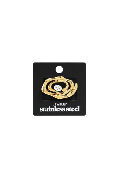 Golden spiral brooch in gold-toned stainless steel with an oval-cut center stone on a black display card.