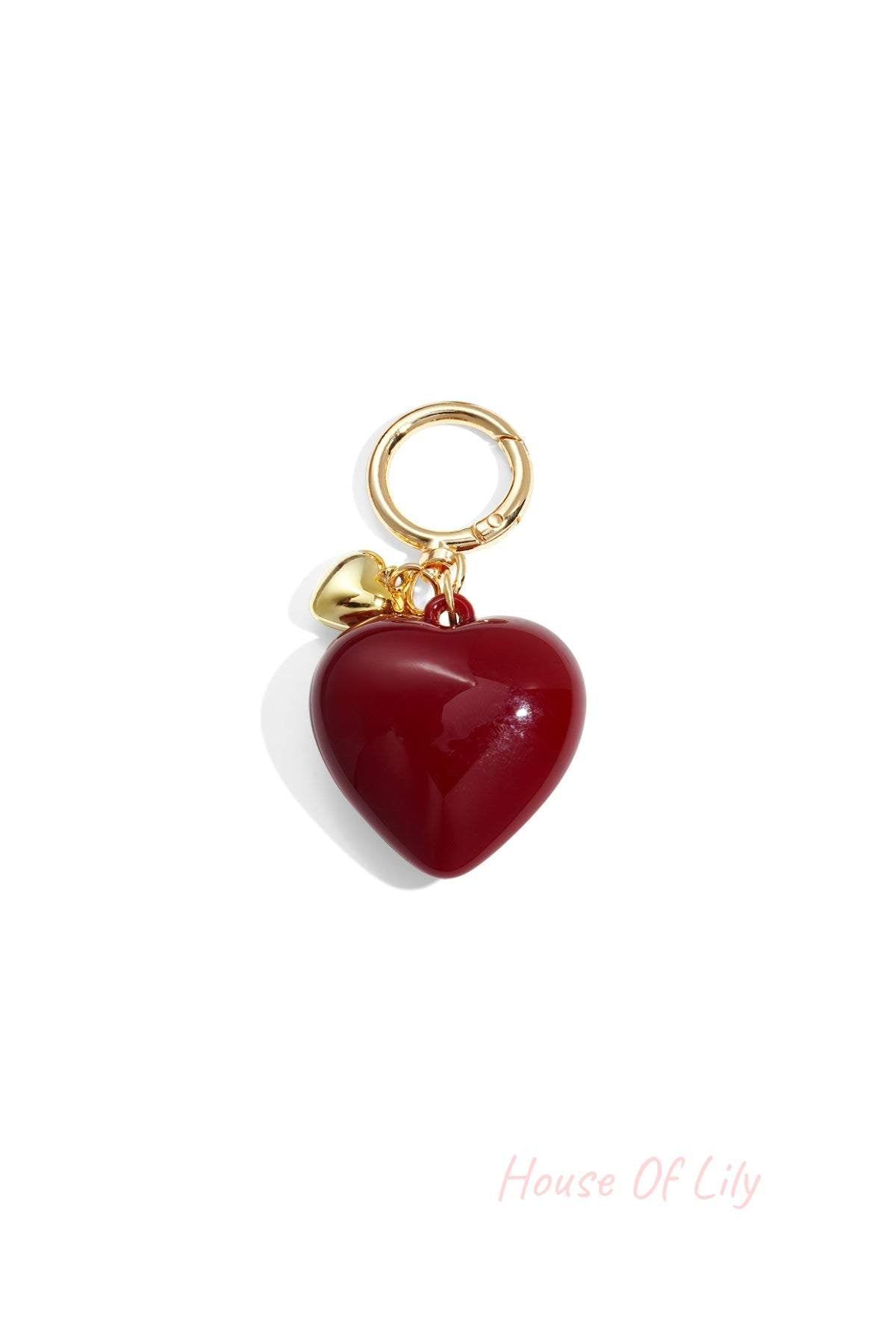 Glossy deep red heart-shaped acrylic bag charm with gold alloy ring and tiny heart charm