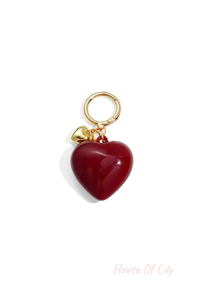 Glossy deep red heart-shaped acrylic bag charm with gold alloy ring and tiny heart charm