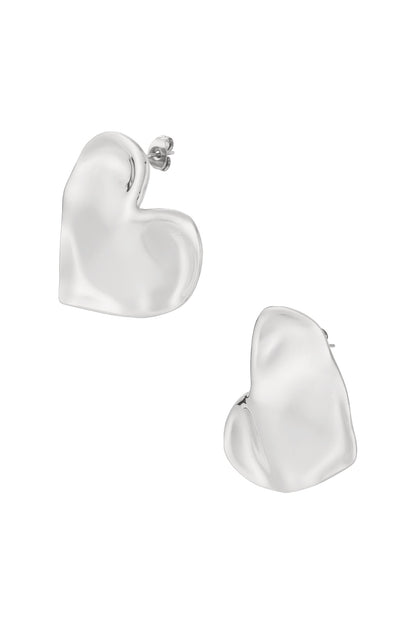 Pair of chunky heart-shaped stud earrings with smooth silver finish on white background