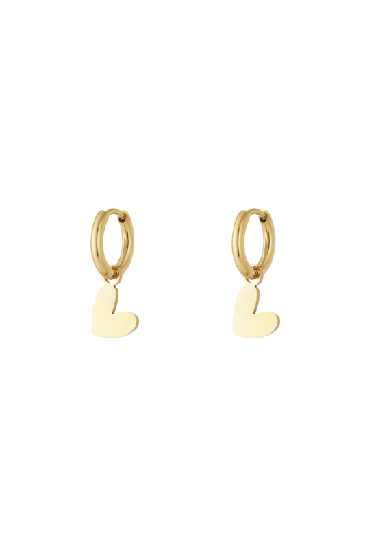 Pair of polished gold heart drop earrings with smooth hoops on plain white background