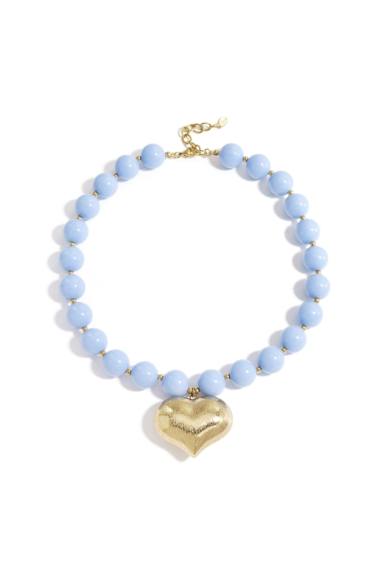 Chunky baby blue beaded necklace with a textured gold heart pendant laid flat