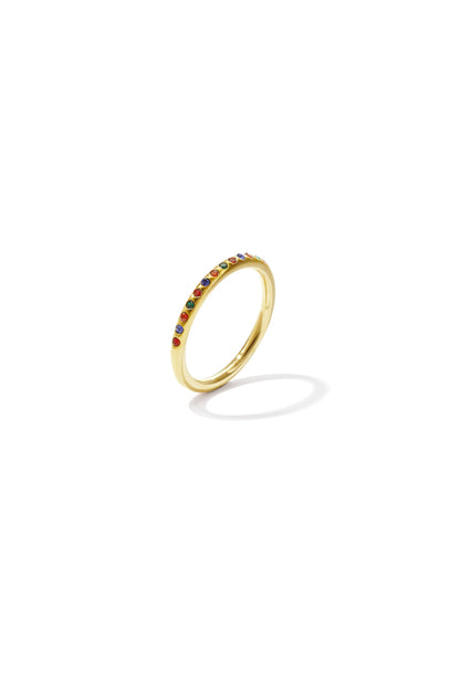 Elegant gold ring with small multicolored stones arranged in a single row on thin band, isolated on white background