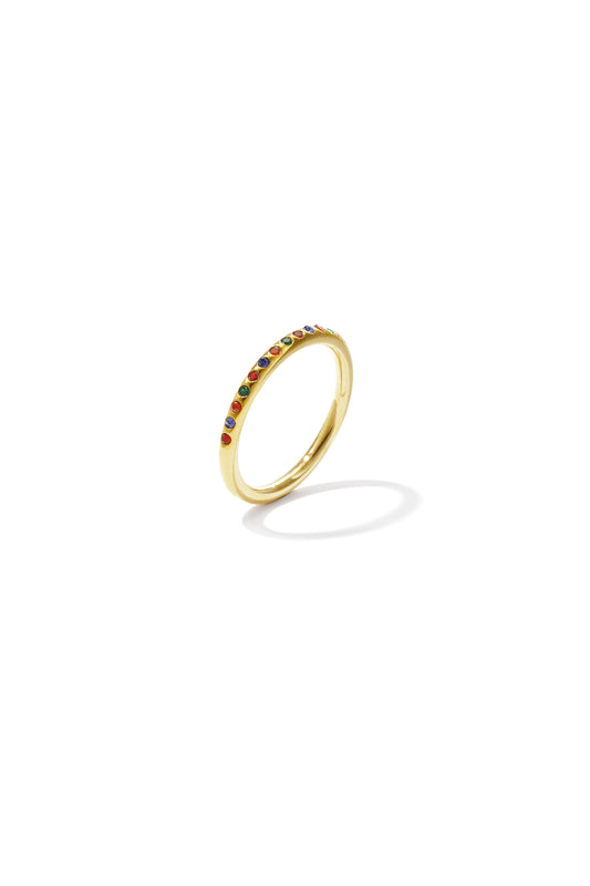 Elegant gold ring with small multicolored stones arranged in a single row on thin band, isolated on white background