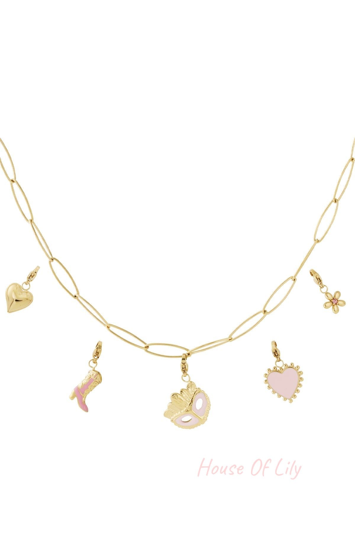 Close-up view of a gold link necklace featuring five charms: heart, floral, pink boot, masquerade mask, and pink heart enamel