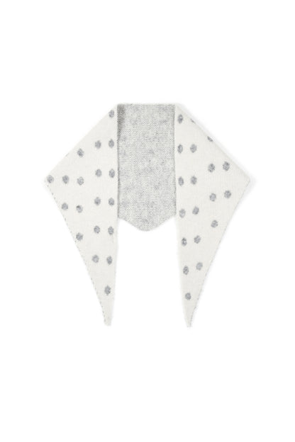Soft knit triangle scarf in white with gray polka dots, flat lay on white background