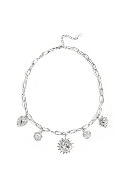 Silver-tone chunky chain necklace with sun and heart charms laid flat on white background