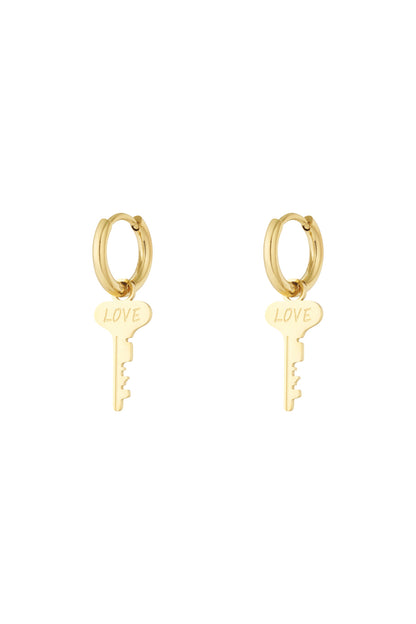 Pair of gold hoop earrings with dangling key-shaped charms engraved with the word 'LOVE' on a white background