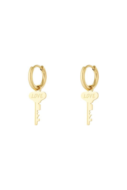 Pair of gold hoop earrings with dangling key-shaped charms engraved with the word 'LOVE' on a white background