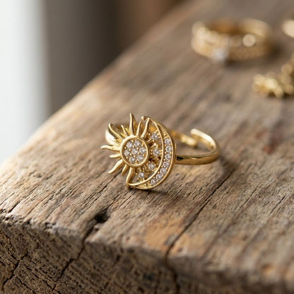 Small, delicate 'Double The Love' ring with rhinestone accents on rustic wooden surface, showcasing intricate details and adjustable band.