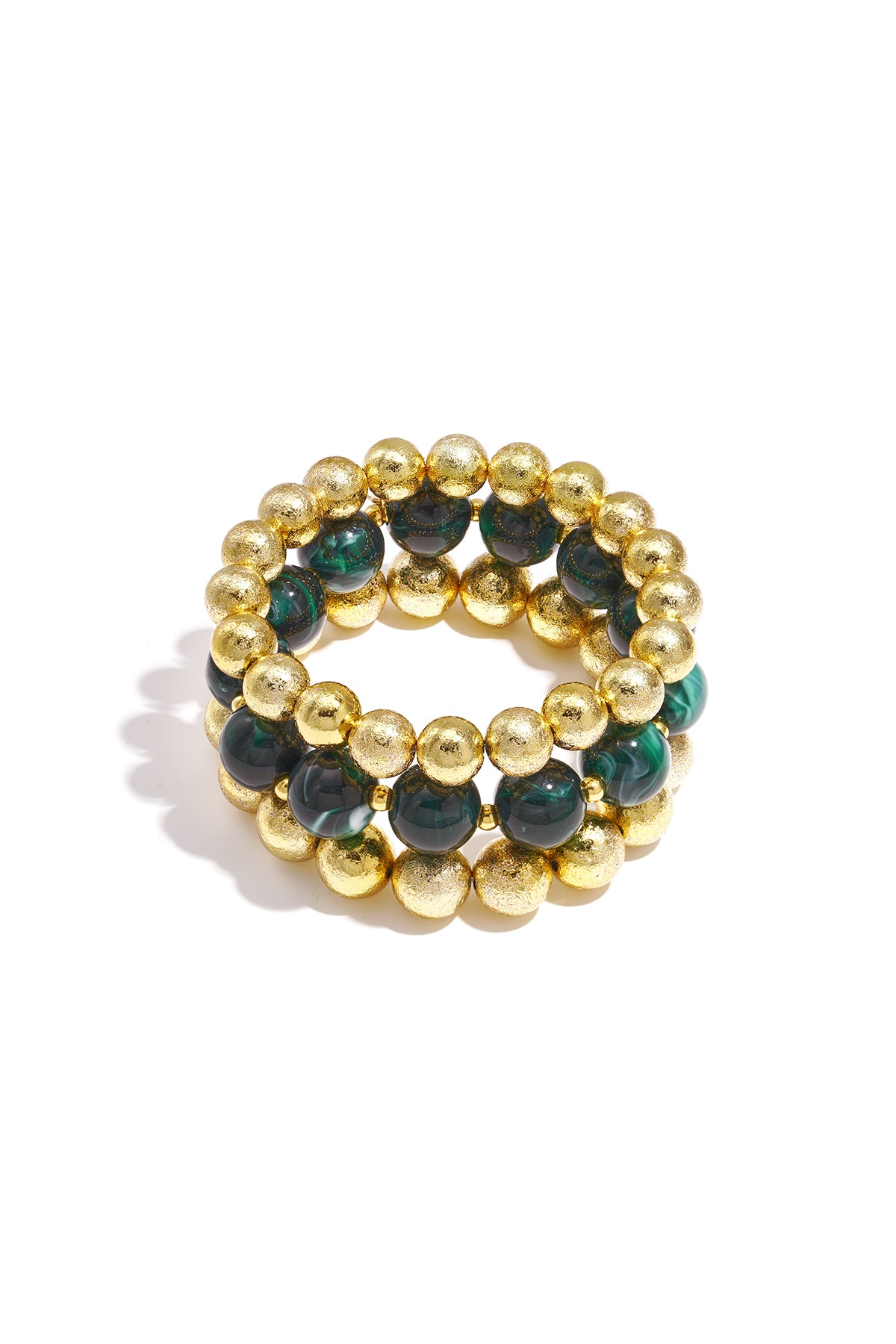 Set of three beaded bracelets with green marbled beads and textured gold spheres on white background