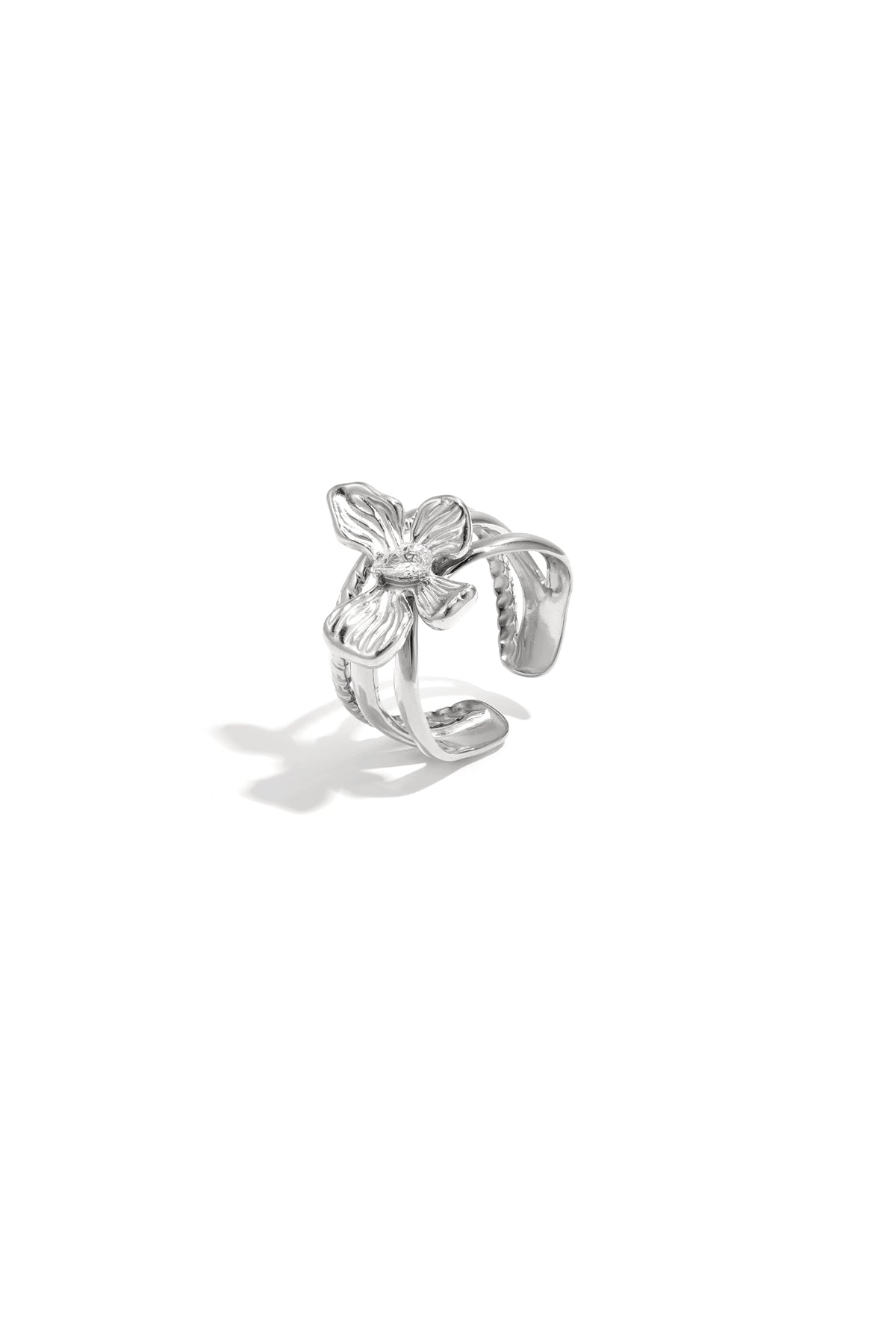 Silver flower accent adjustable statement ring with rhinestone center and layered petals on white background