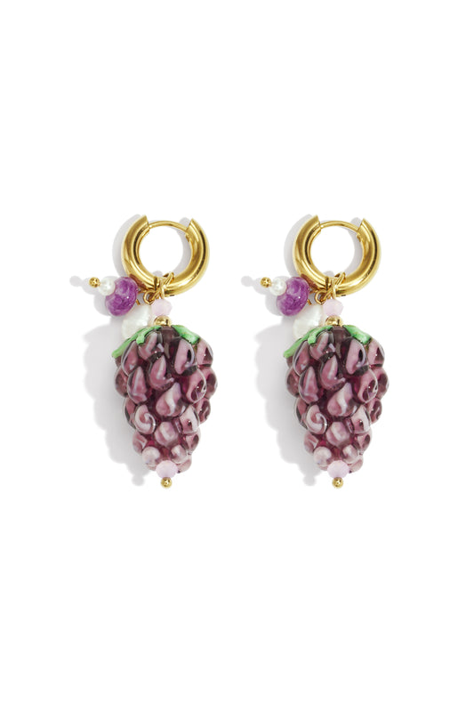 Pair of gold hoop drop earrings with detailed purple grape-shaped glass charms and accent beads