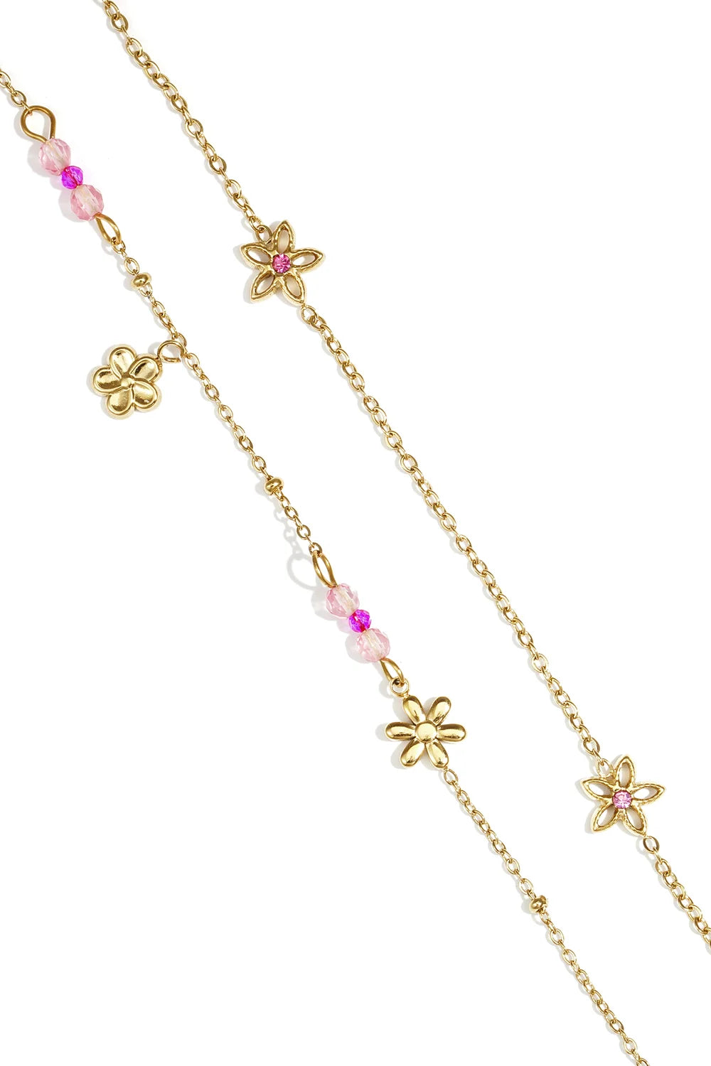 House of Lily gold layered bracelet featuring daisy charms and delicate pink crystal beads on a dainty chain.