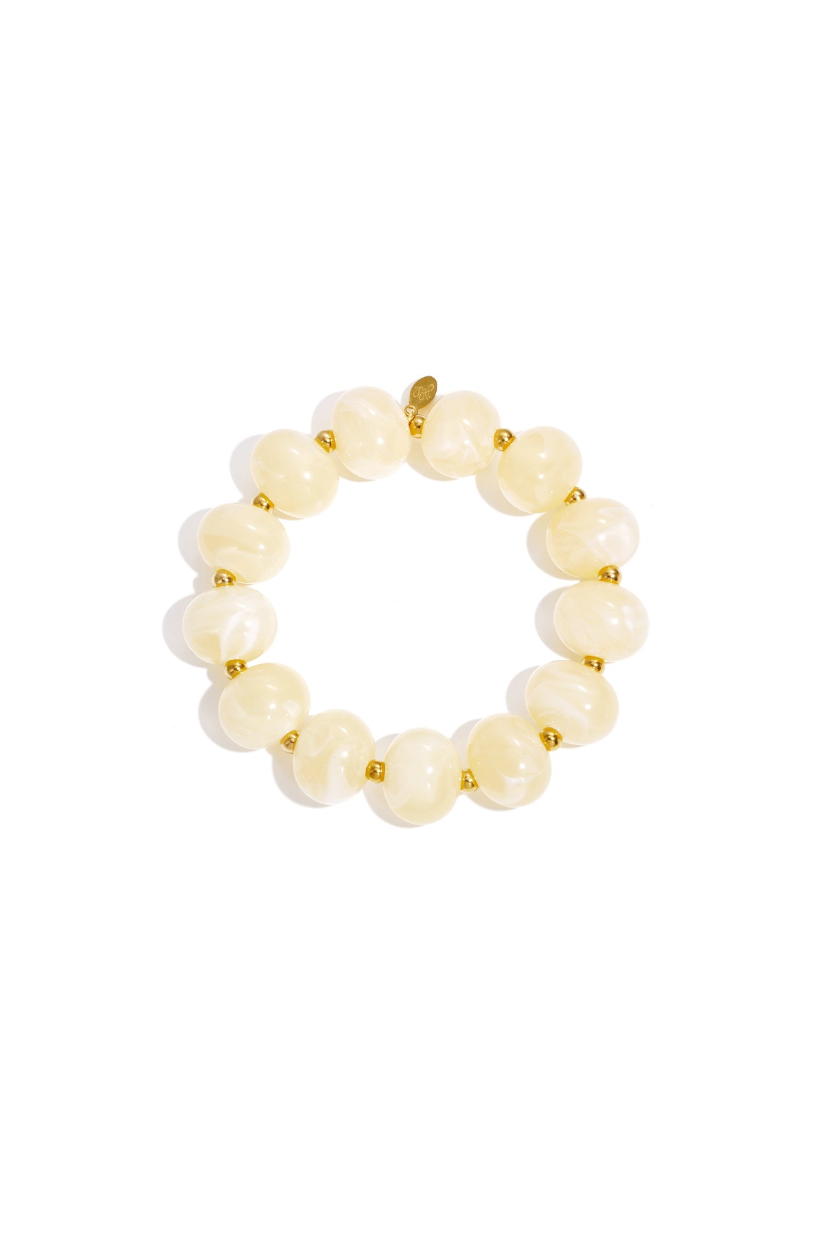 Cream marbled beaded stretch bracelet with gold accent spacer beads on white background