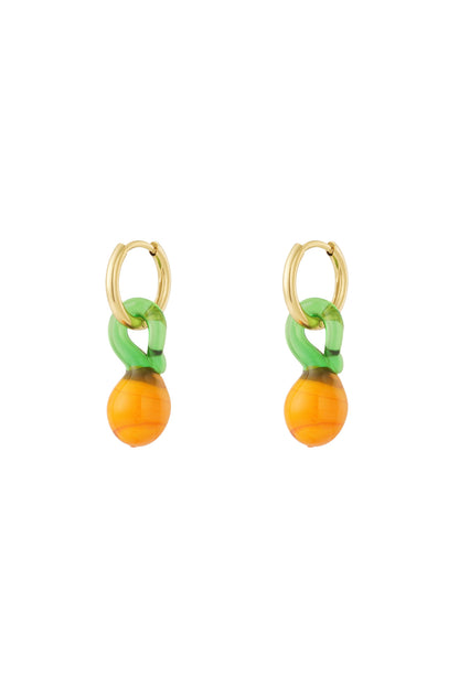 Pair of gold-plated hoop earrings with dangling orange and green resin fruit-inspired charms on a white background