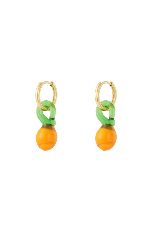 Pair of gold-plated hoop earrings with dangling orange and green resin fruit-inspired charms on a white background