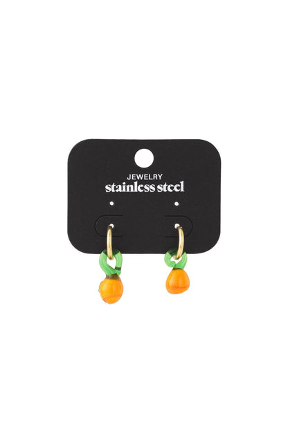Citrus drop earrings featuring small gold hoops with green leaf and orange fruit glass charms on a display card.