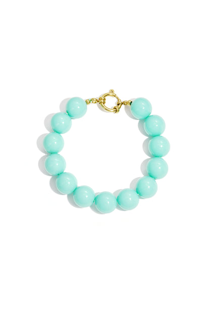 Mint green chunky beaded bracelet showcasing glossy resin beads and gold clasp