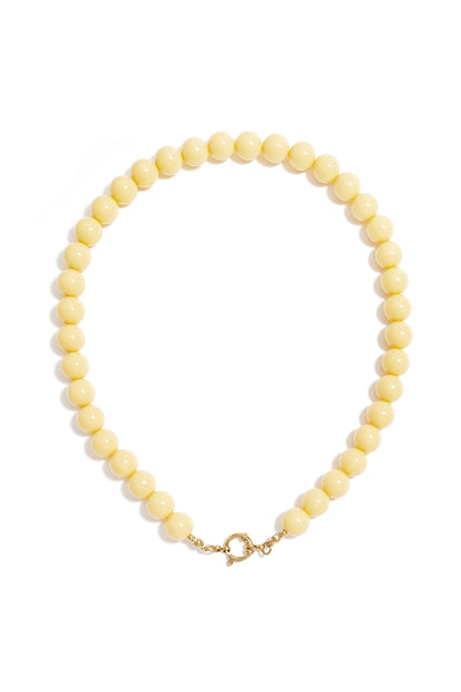 Single strand necklace with glossy passion red resin beads and gold spring ring clasp on white background