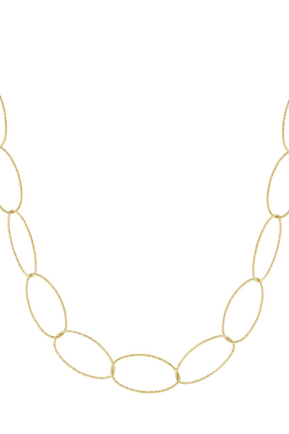 Close-up of textured gold-tone chunky oval link necklace on white background