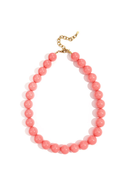 Light green chunky resin beaded necklace with gold chain clasp photographed on white background