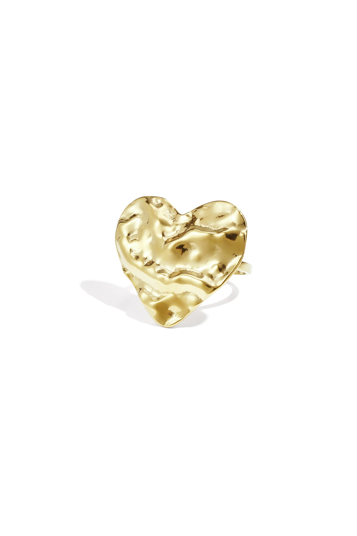 Close-up of a textured gold heart-shaped statement ring on white background