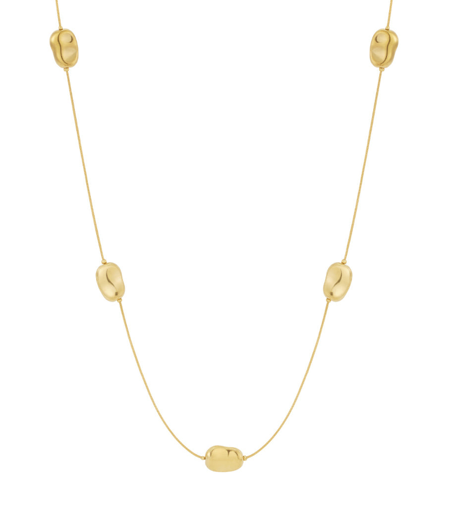 Minimalist long gold necklace with five polished bean-shaped beads evenly spaced on delicate chain
