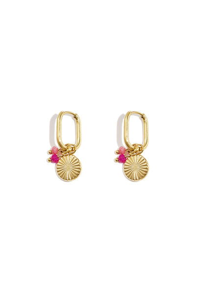 Pair of gold rectangular hoop earrings with sunflower charm and pink beads on white background
