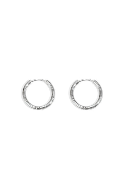 Pair of small silver hoop earrings with smooth rounded design set on a white background