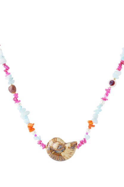 Colorful beaded necklace with a unique shell-shaped centerpiece on white background