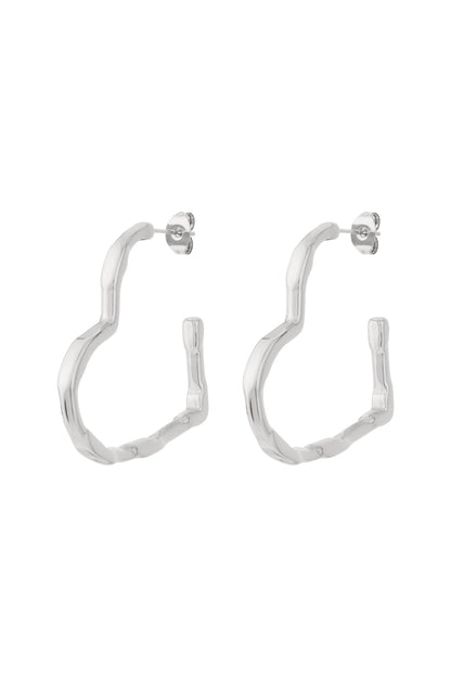 Pair of silver wavy heart hoop earrings displayed on white background