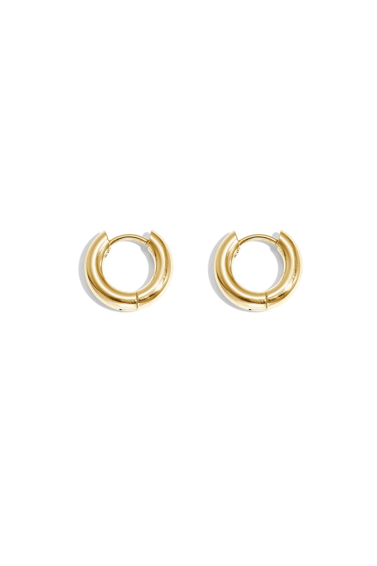 Pair of chunky gold hoop earrings with smooth polished finish on white background
