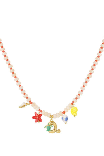 Beaded necklace featuring pastel pink beads, small red accents, and nautical charms including a gold sea turtle.