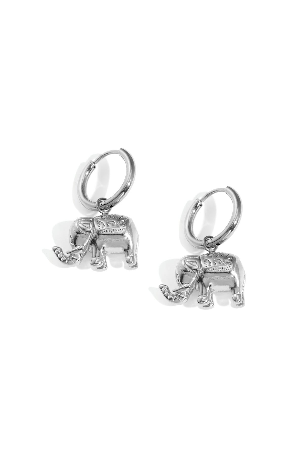 Pair of silver elephant charm hoop earrings on white background