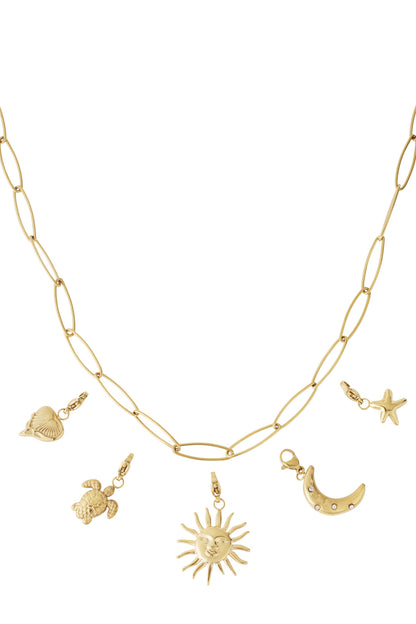 Gold elongated link chain necklace with five detachable charms including sun, crescent moon with stones, starfish, turtle and heart-shaped shell on white background