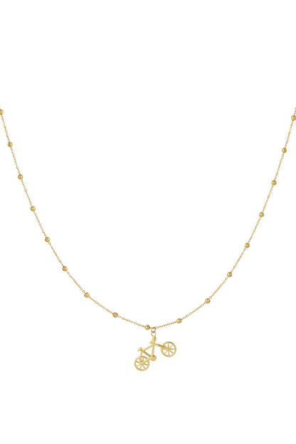 Gold bicycle pendant necklace with beaded chain on white background