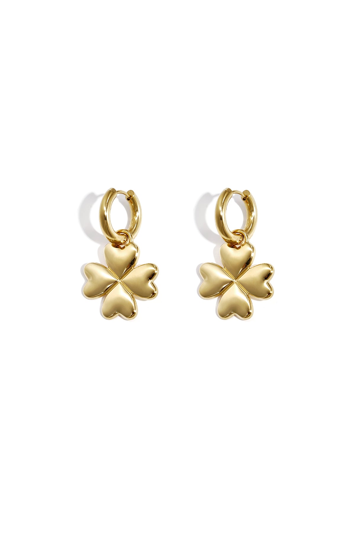 Pair of gold four-leaf clover hoop earrings with heart-shaped petals on white background